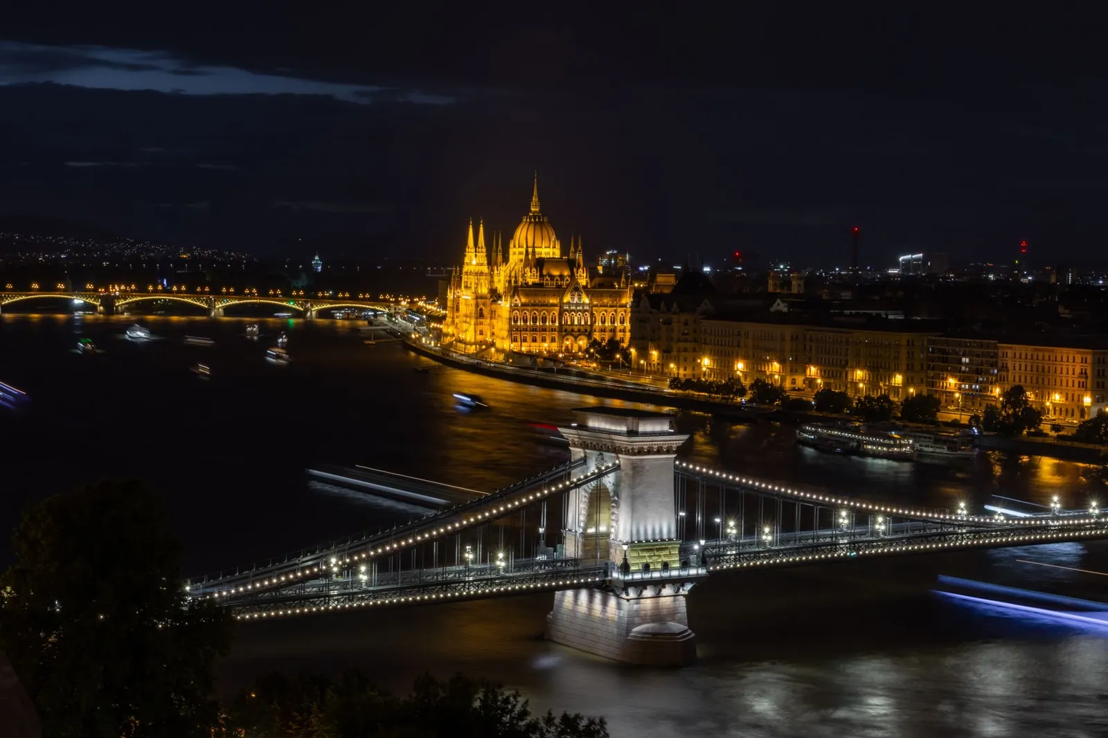 Budapest glowing over the Danube at night